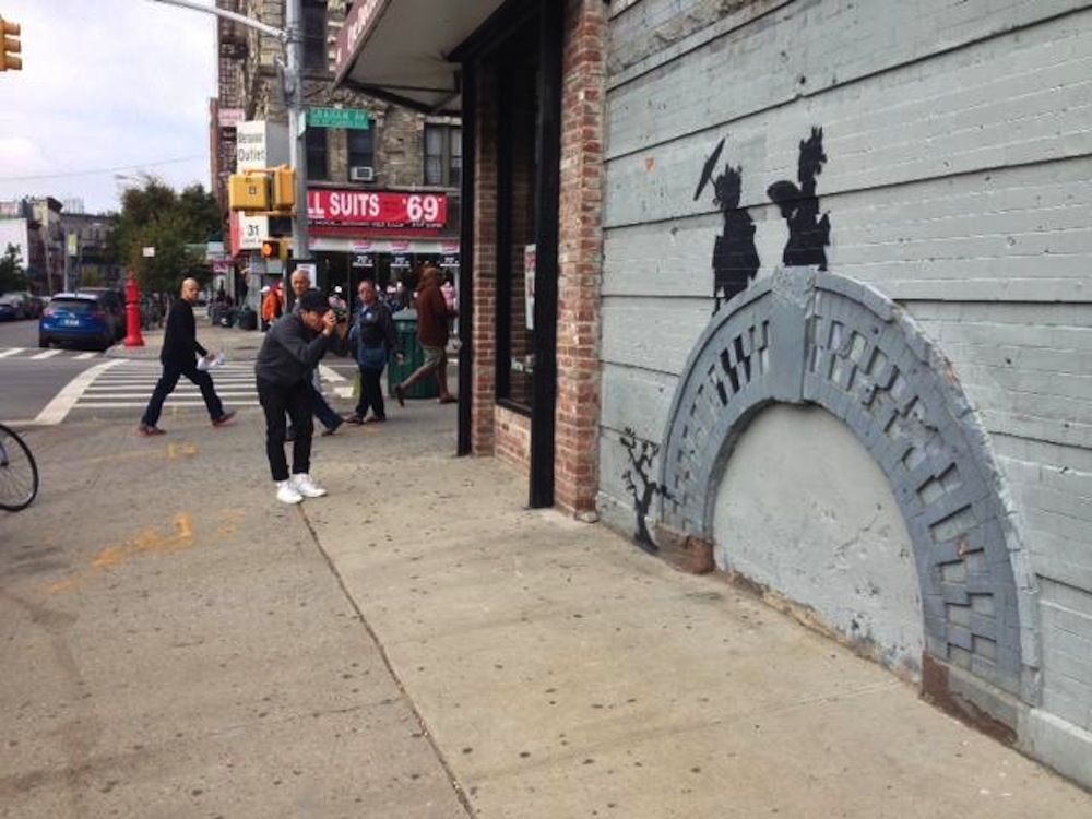 Grade: B<br/>Went up on <a href="http://gothamist.com/2013/10/17/banksy_bed_stuy.php#photo-1">October 17</a><br/>Located at Cook Street and Graham Avenue in Brooklyn<br/>